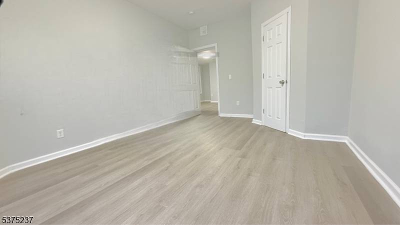 This property presents a superior investment opportunity with three spacious apartment units, each comprising four bedrooms and equipped with separate utility meters.