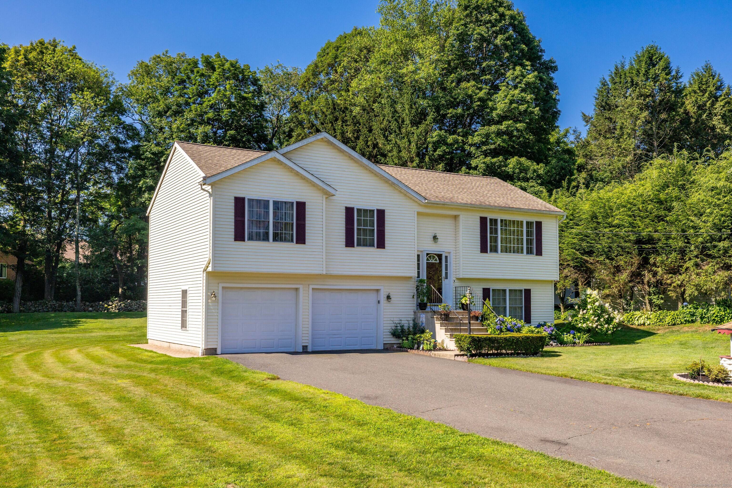 This lovely, well maintained newer raised ranch is perfectly situated on a quiet cul de sac, offering both privacy and convenience.