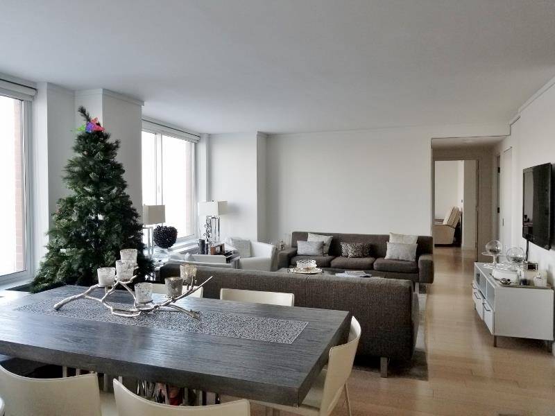 Battery Park City is a bright waterfront unit with full Hudson River and park views.