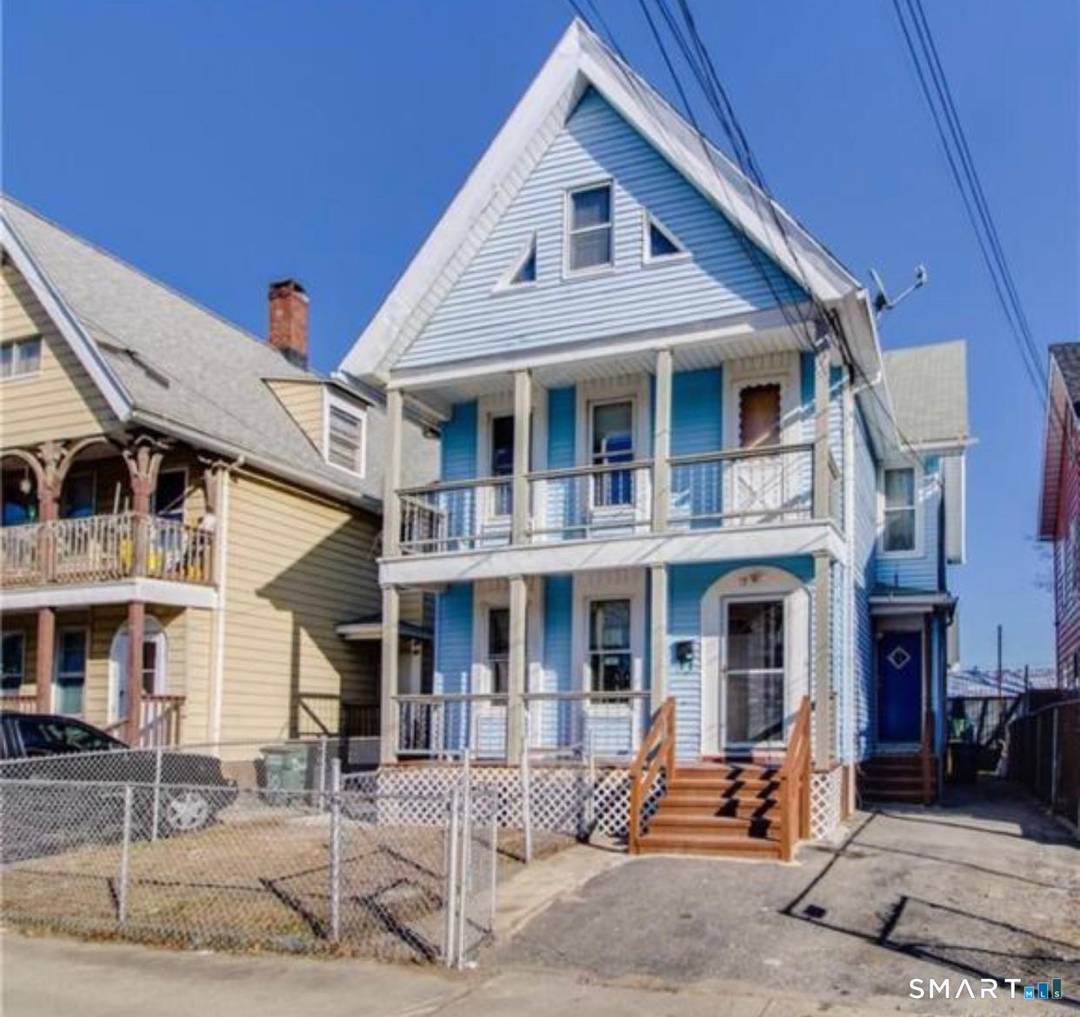 This well maintained two family home features two spacious units, each with three bedrooms, offering ample living space and comfortable layouts.