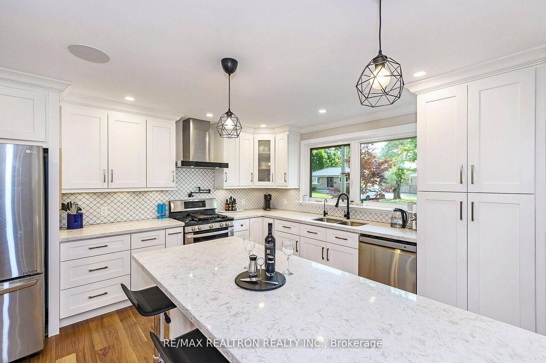 Nestled in a tranquil crescent on a large lot with mature trees, only two streets north of Lake Ontario.