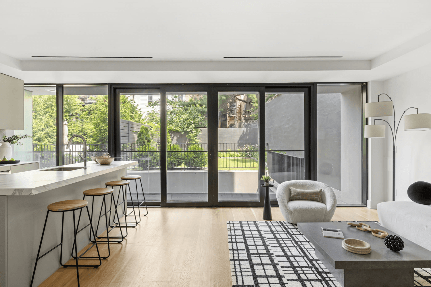 Welcome to 153 Green Street, Residence 1B, a stunning one bedroom, one and a half bath garden duplex that blends high design with exceptional functionality across two spacious levels, complete ...