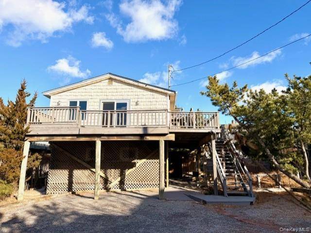 Escape to your own slice of the Hamptons with this beautifully renovated coastal cottage, perfectly positioned just steps from the ocean on coveted Dune Road.