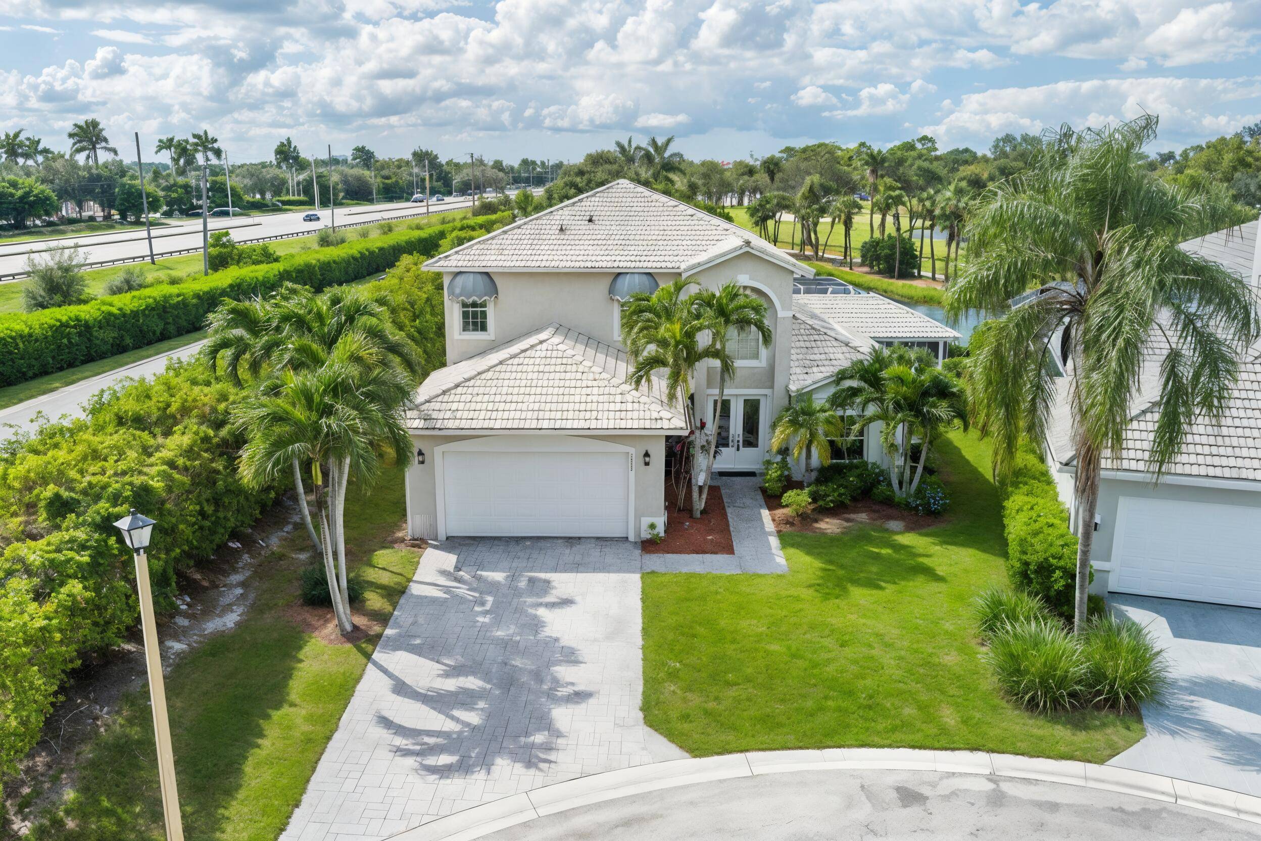 Bermuda style home tucked within the peaceful Spray Cottages of Breakers West.