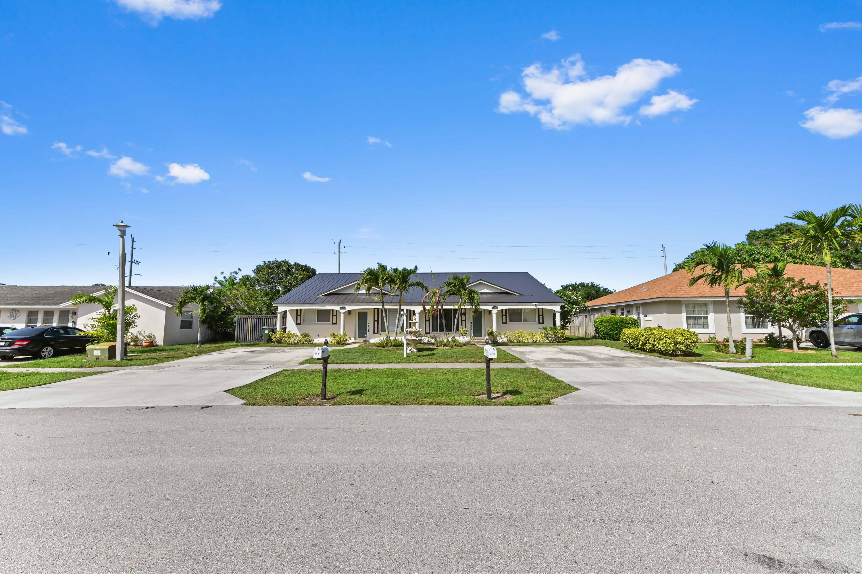 Opportunity knocks in Wellington with this fantastic duplex, nestled in a desirable non HOA community !