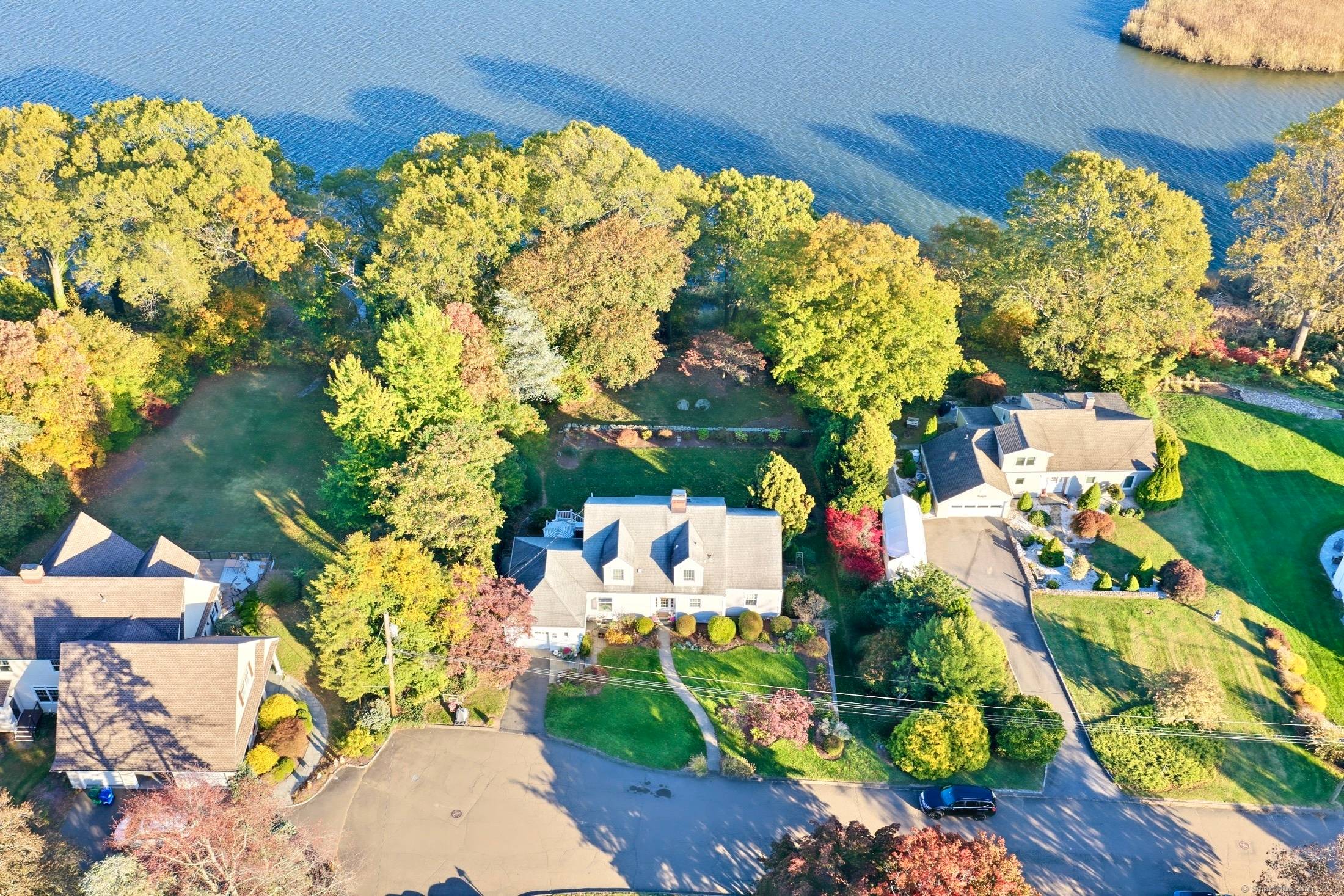 Perfectly set at the end of a quiet cul de sac overlooking the Housatonic River, this beautifully reimagined Cape offers timeless craftsmanship and elevated design.