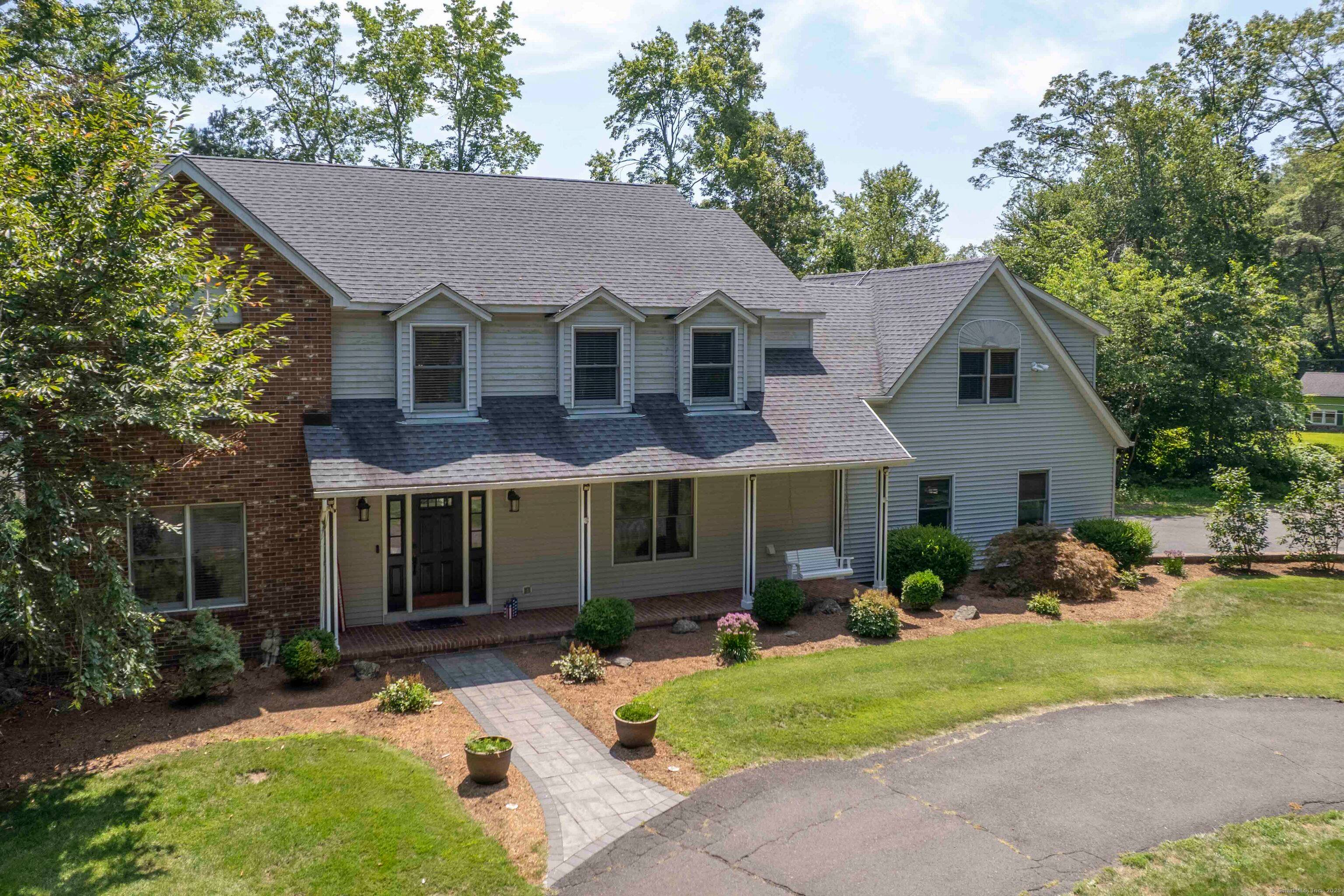 Welcome home ! This large colonial style home features 4 bedrooms, 2.