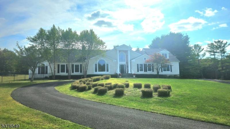Welcome to your dream retreat on 5 manicured acres in desirable Mendham Boro.