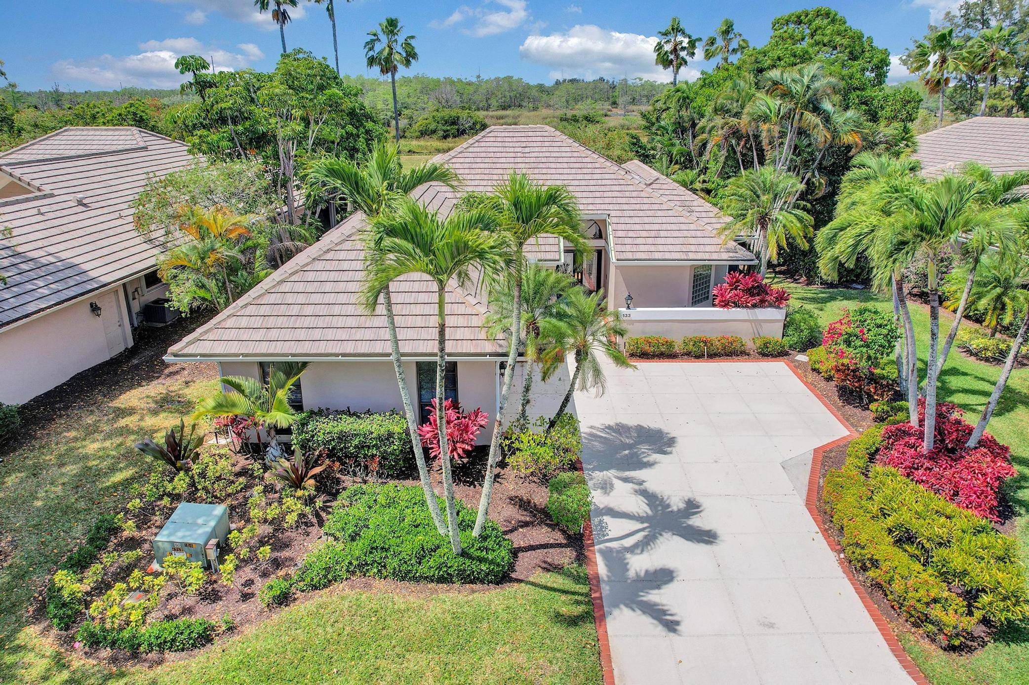 Stunning home in the highly sought after Coventry neighborhood within PGA National Resort.