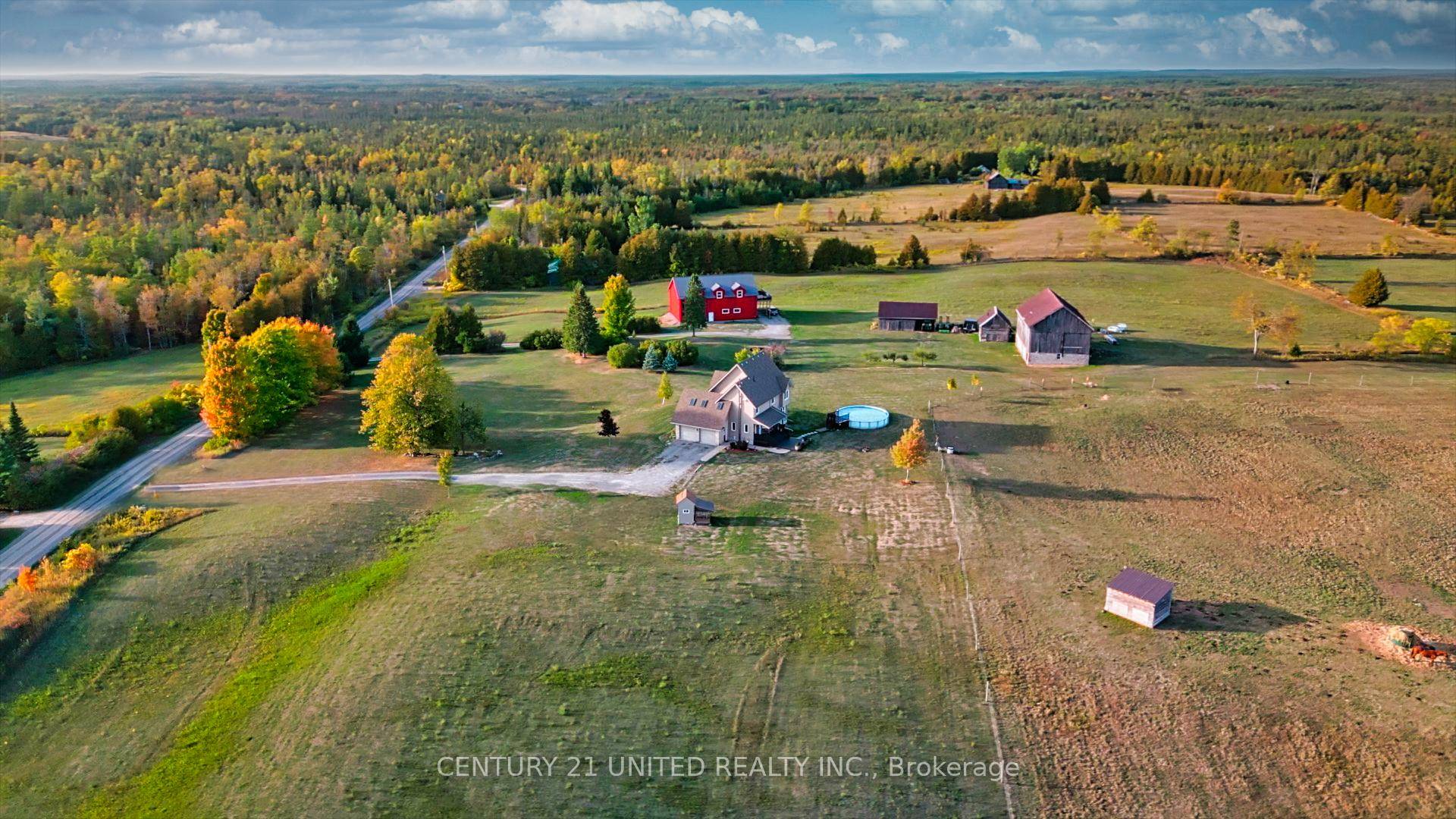 Two dwellings a modern barndominium and a 2200 Sq Ft main home sit on this beautiful 112 acre farm, blending comfort and rural charm.