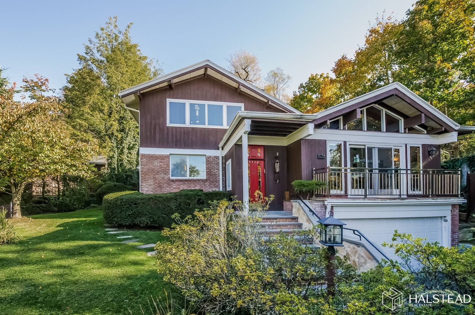 A magnificent 2 story home nestled on a hill in a serene setting in Riverdale overlooking the Hudson River and the Palisades.
