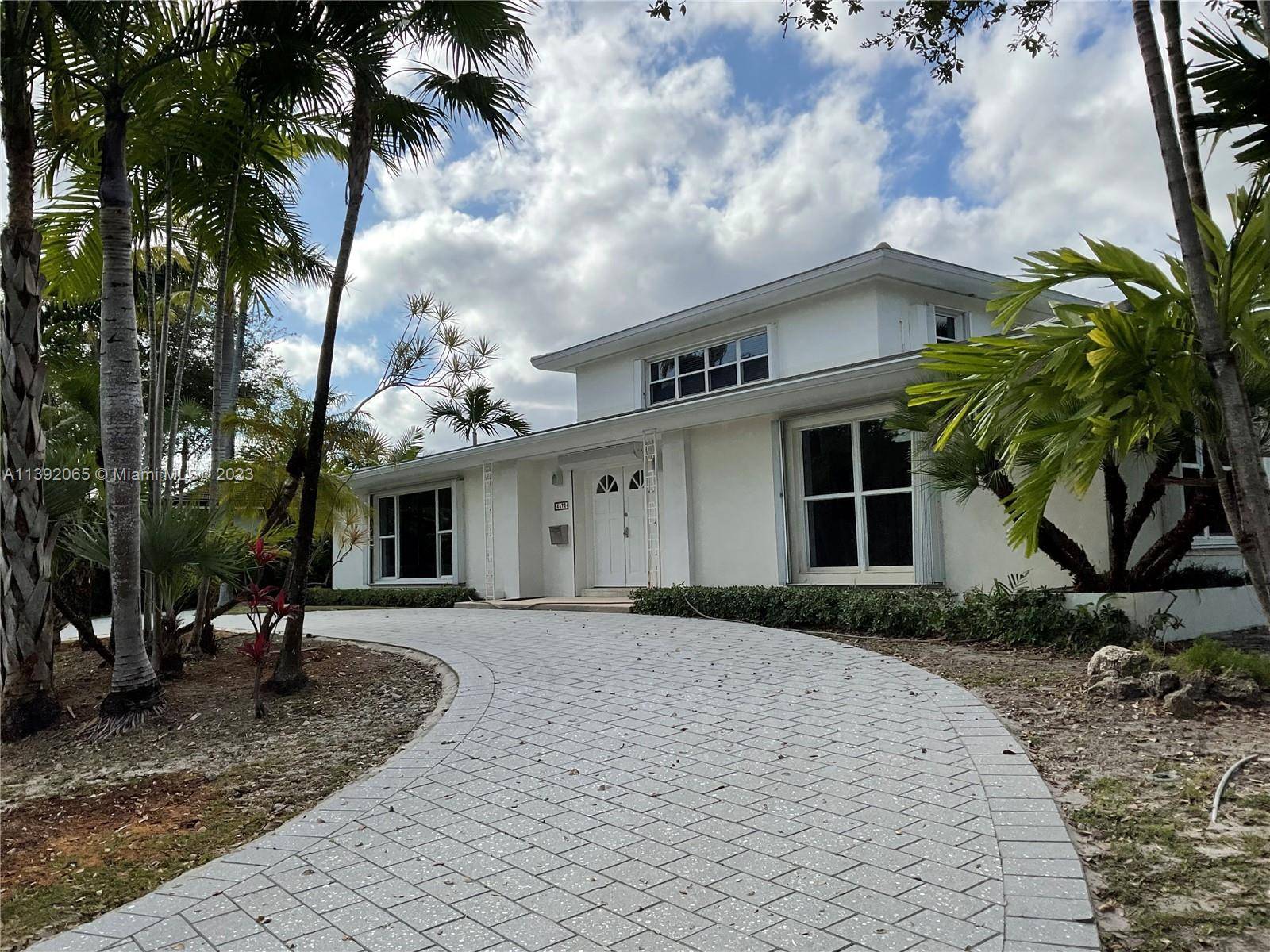 Sprawling Mid Century home, bright with lots of closets located at Bay Point one of the most sought after communities in Miami.