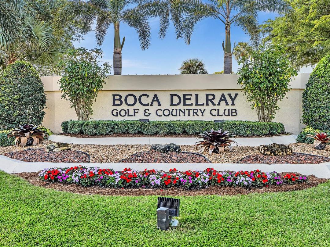 Enjoy the 2027 season in this freshly painted, ground floor condo with tranquil lake views in Boca Delray Country Club.