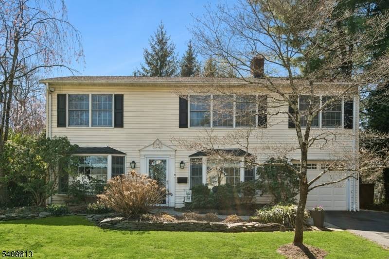 Beautiful center hall Colonial set on a thoughtfully landscaped property at the end of a quiet, tree lined street in Madison.