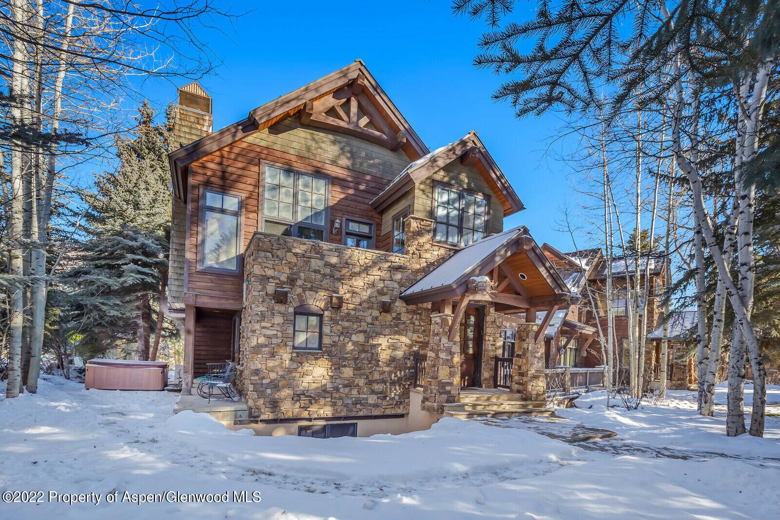 Stone and timber designed townhome that feels like a single family home.