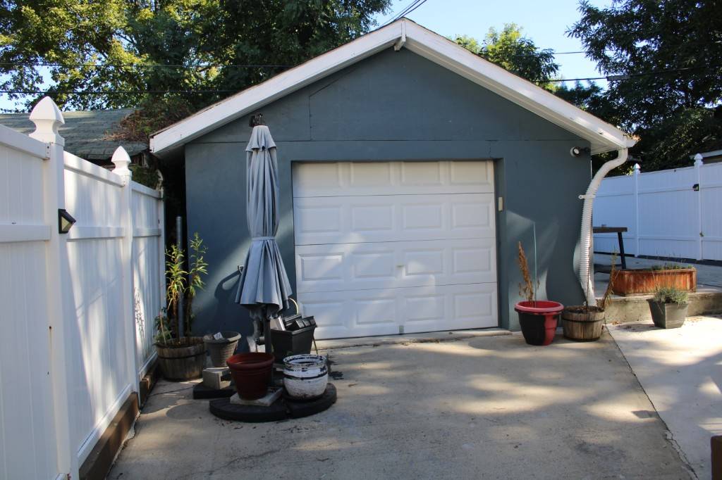 Welcome to 219 19 143rd Road, a well kept two family home offering space, versatility, and exceptional outdoor living.