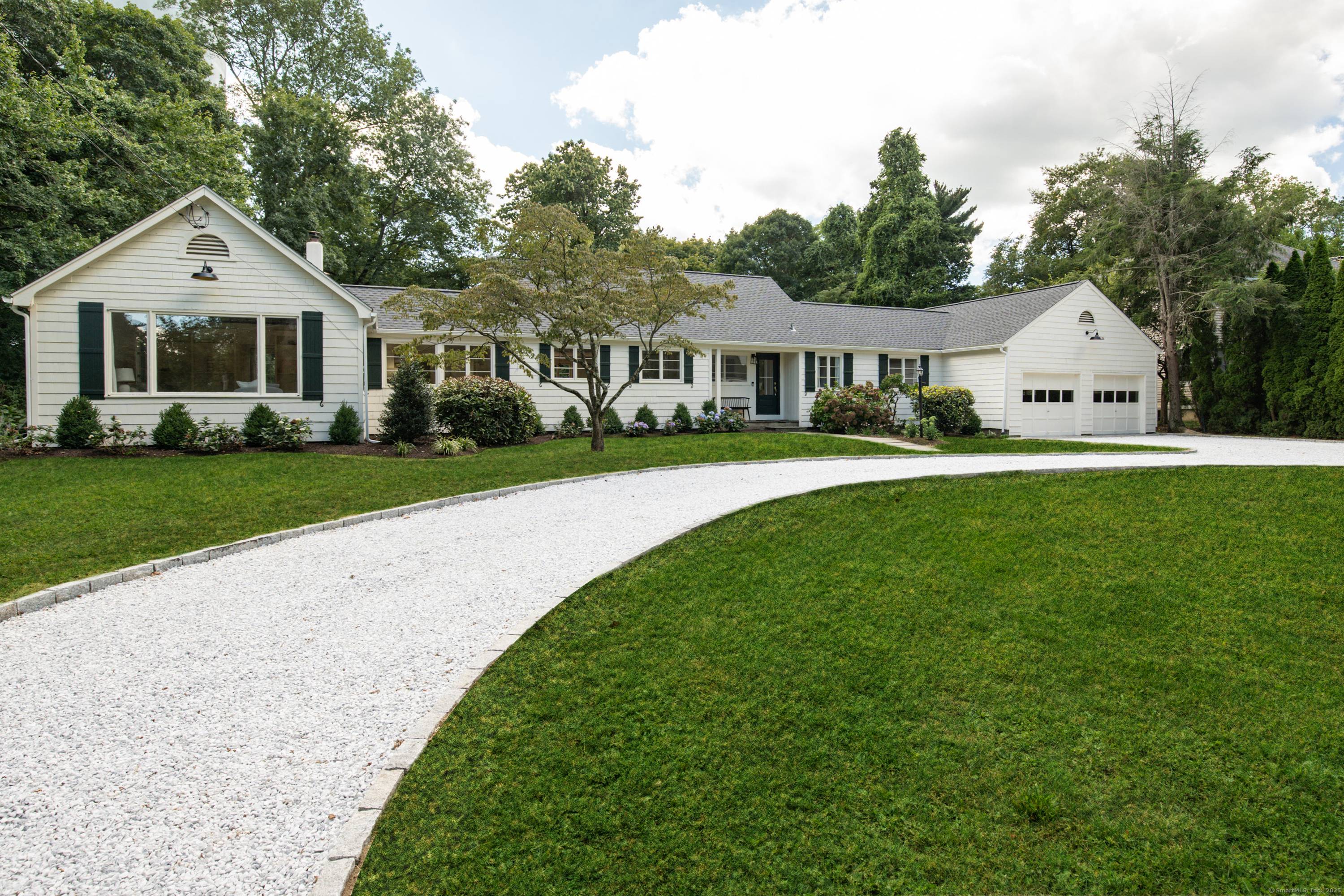 Set on a sweeping acre in Rowayton, this renovated home offers 3, 601 sq.