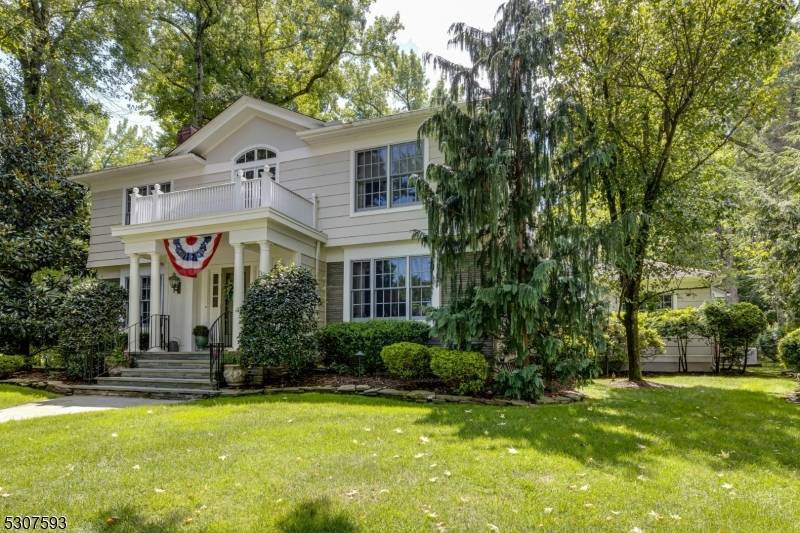 Nestled on a Private Lane, this elegant Custom Colonial Home blends timeless design with modern amenities.