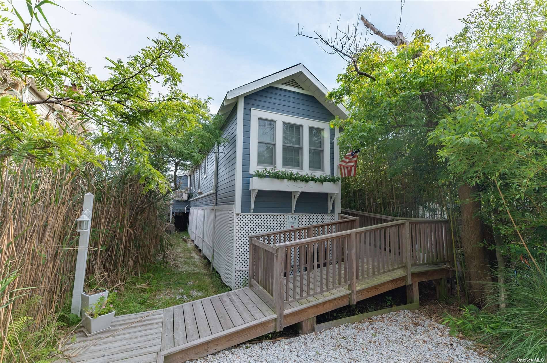 Adorable beach home with one bedroom amp ; one amp ; 1 2 baths has potential for more bedrooms, back deck for entertaining.