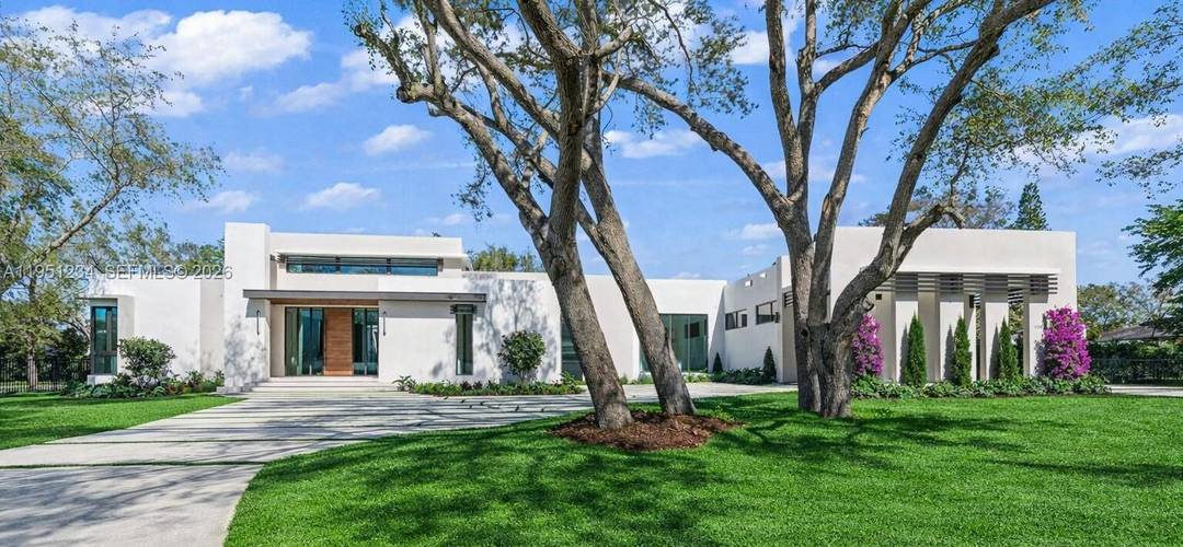 Brand new one story corner modern masterpiece on an acre of land, over 8, 660 SF surrounded by mature oak trees on scenic Old Cutler Road in North Palmetto Bay.