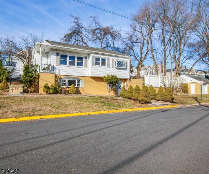 A paver walkway greets you and leads to a lovely open front porch, welcoming you into this beautifully renovated raised ranch for rent on a desirable corner property.