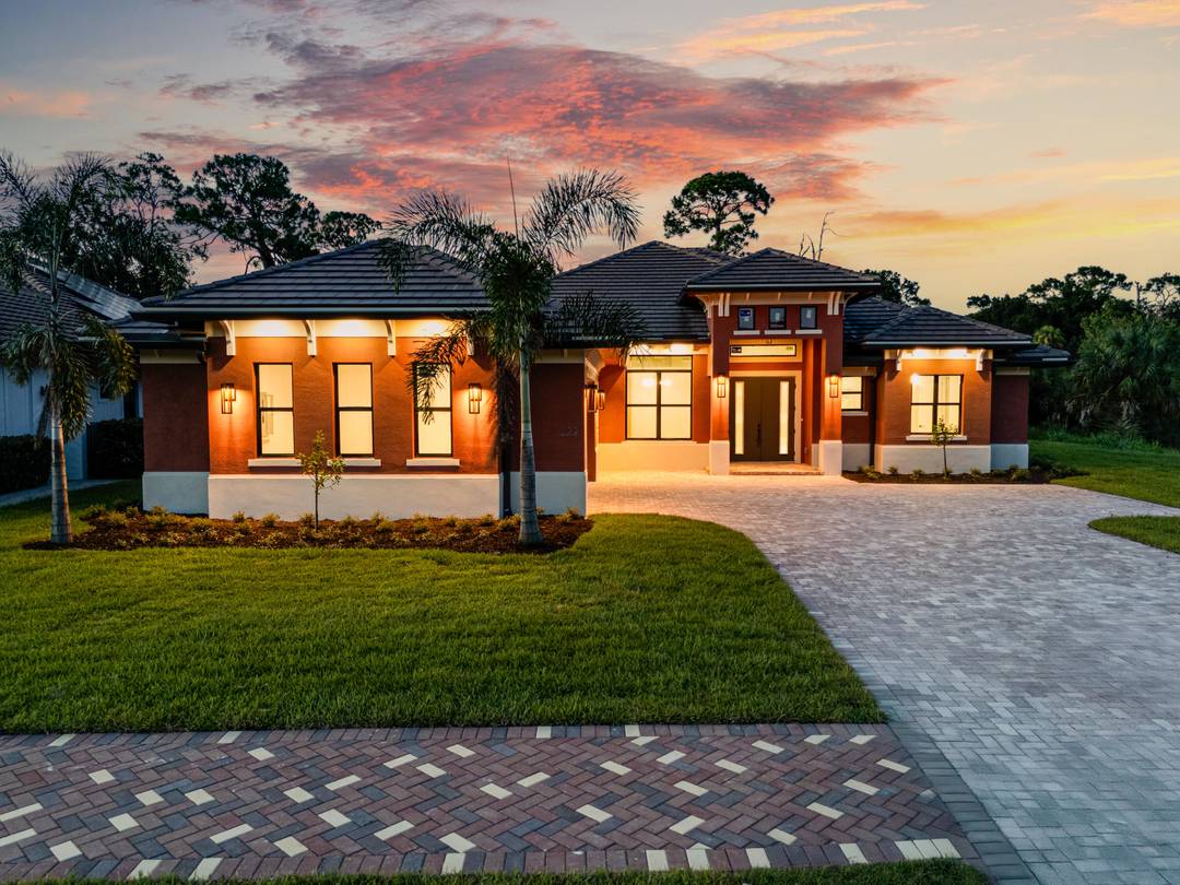 This is the only home of its kind, a custom, never before built design in the gated community of Rivella, set on a premium corner lot with preserve views.