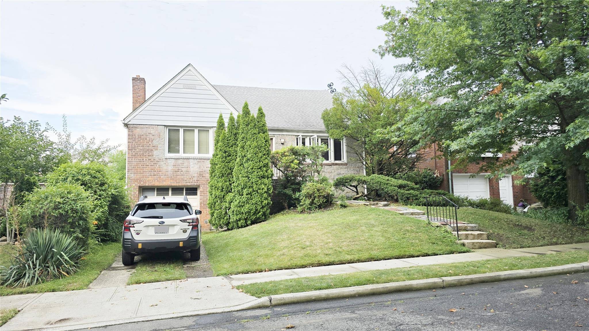 Welcome to this charming home in the highly desirable Weeks Woodland section of Bayside !