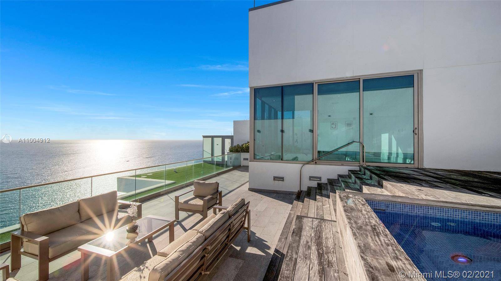 Dive into the ocean from this upper penthouse at the luxurious Oceana Bal Harbour Condo.