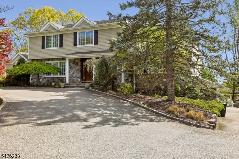 Located in the highly desirable Riker Hill neighborhood, this classic side hall Colonial sits on a beautifully landscaped.