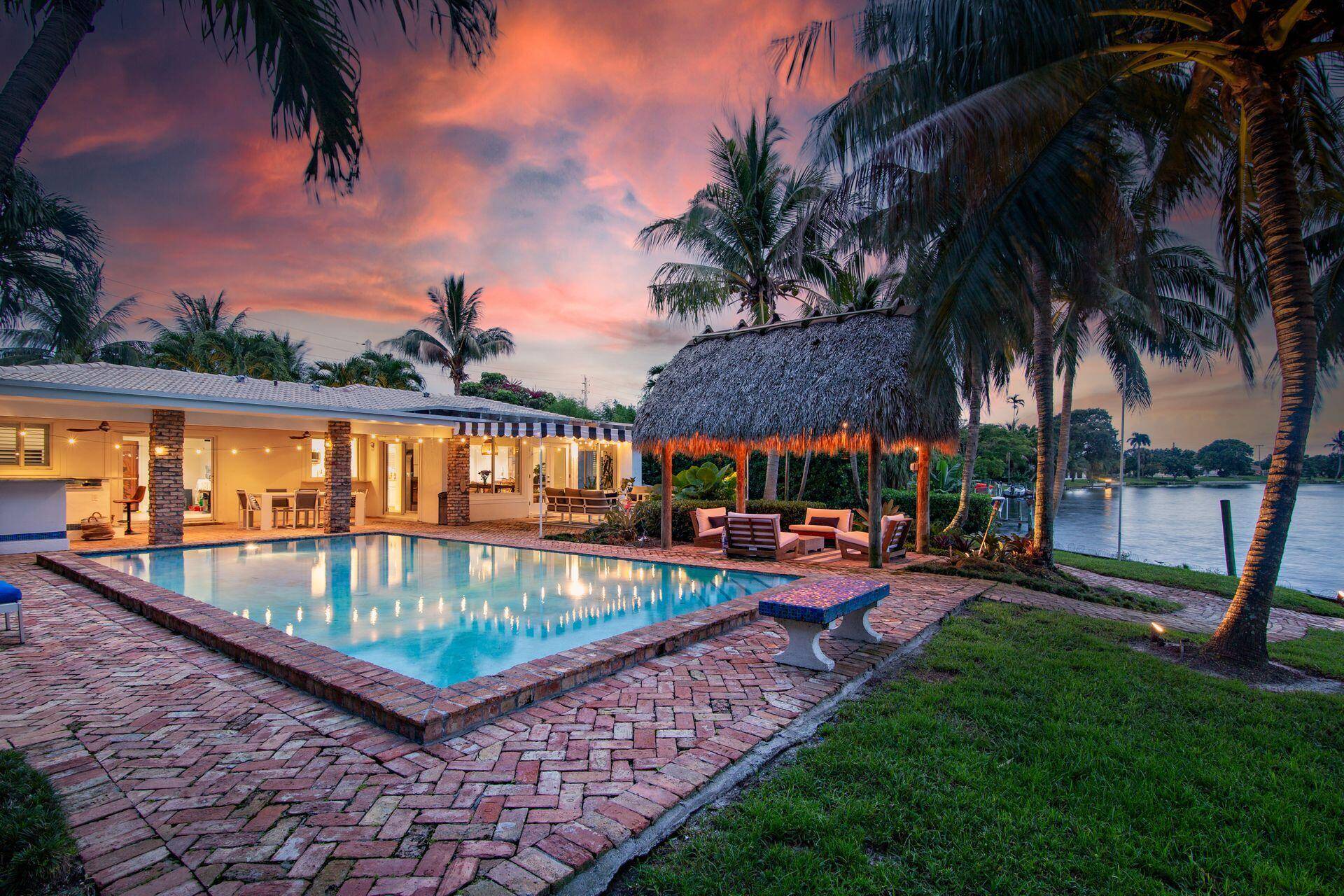 7813 PINE TREE LANE Spectacular waterfront home with a one of a kind resort style backyard !