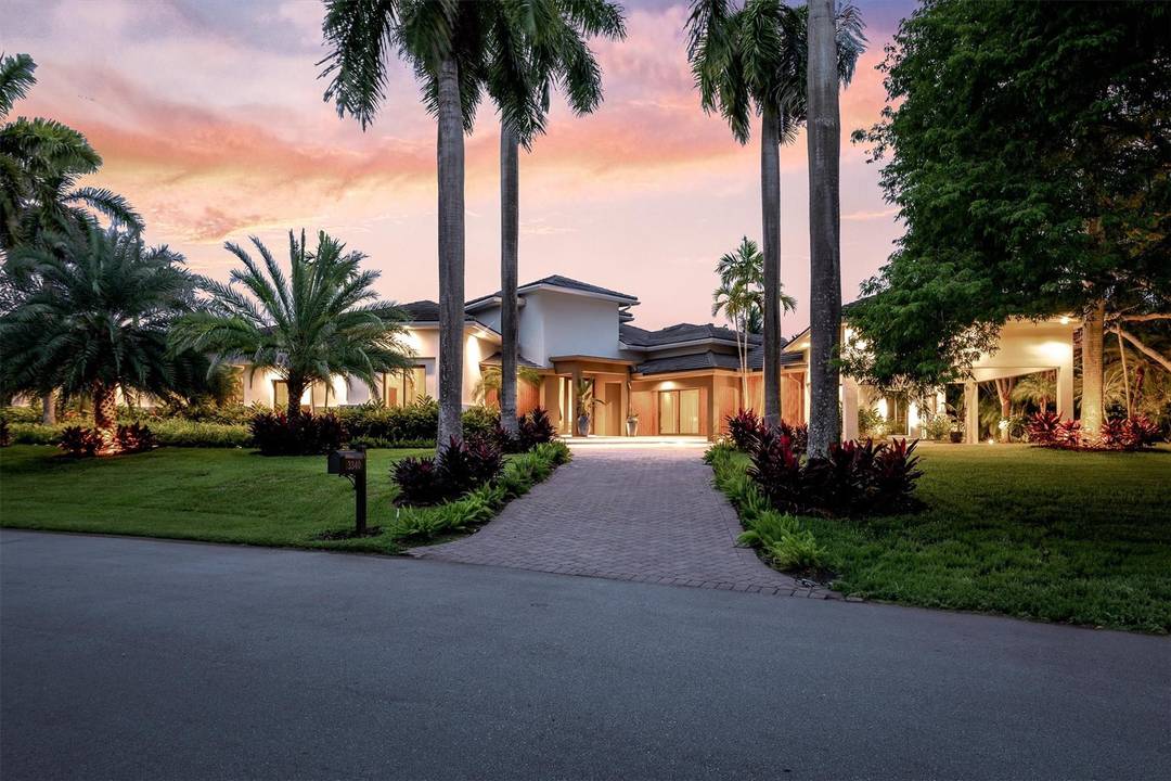 Step into what many will call the finest home on the market in Weston today, where photos simply cannot capture the scale, light, and emotion of this waterfront masterpiece.