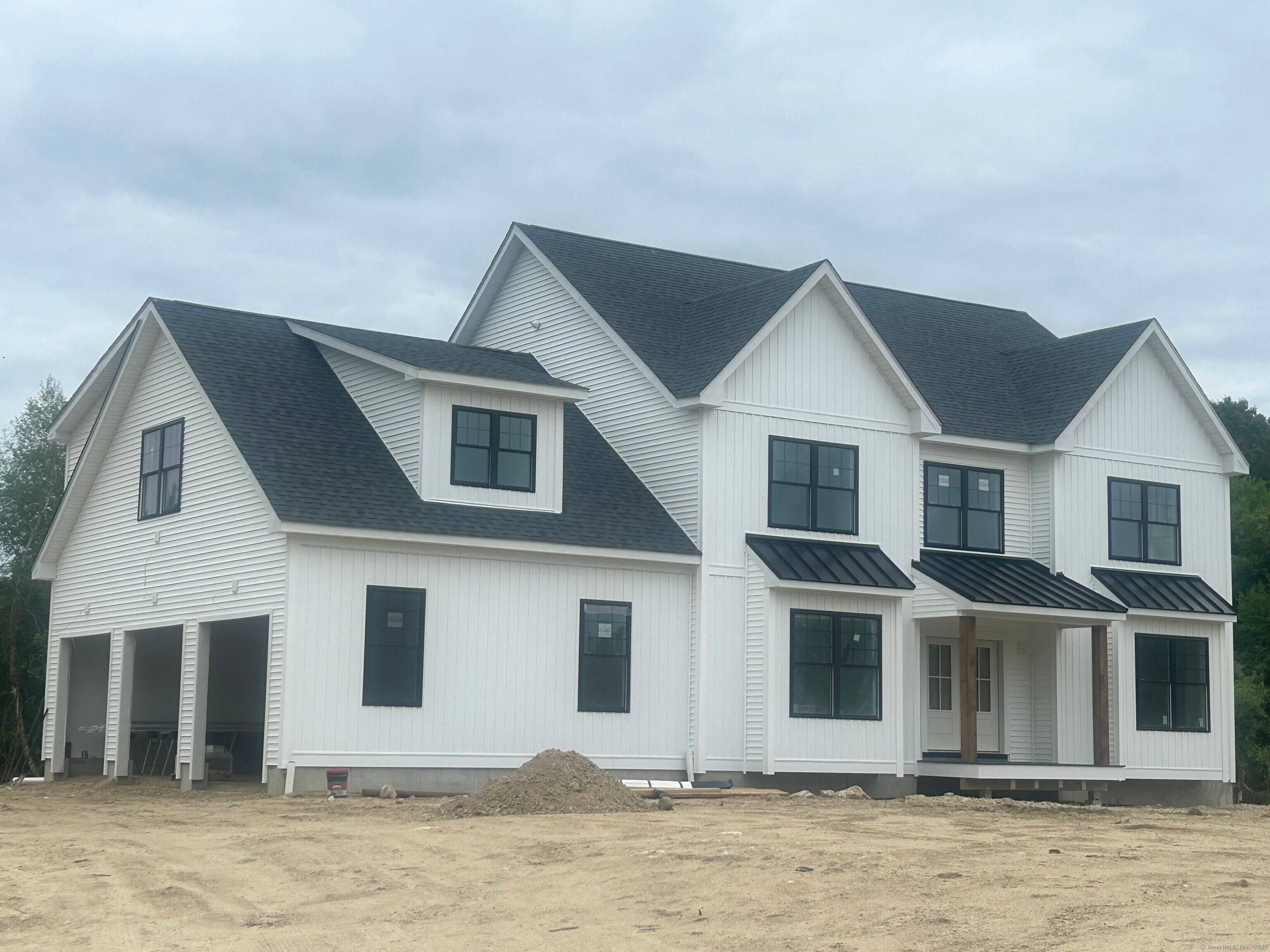 Nestled in a picturesque East Lyme subdivision, this new construction home showcases exceptional craftsmanship and thoughtful detail in every room.