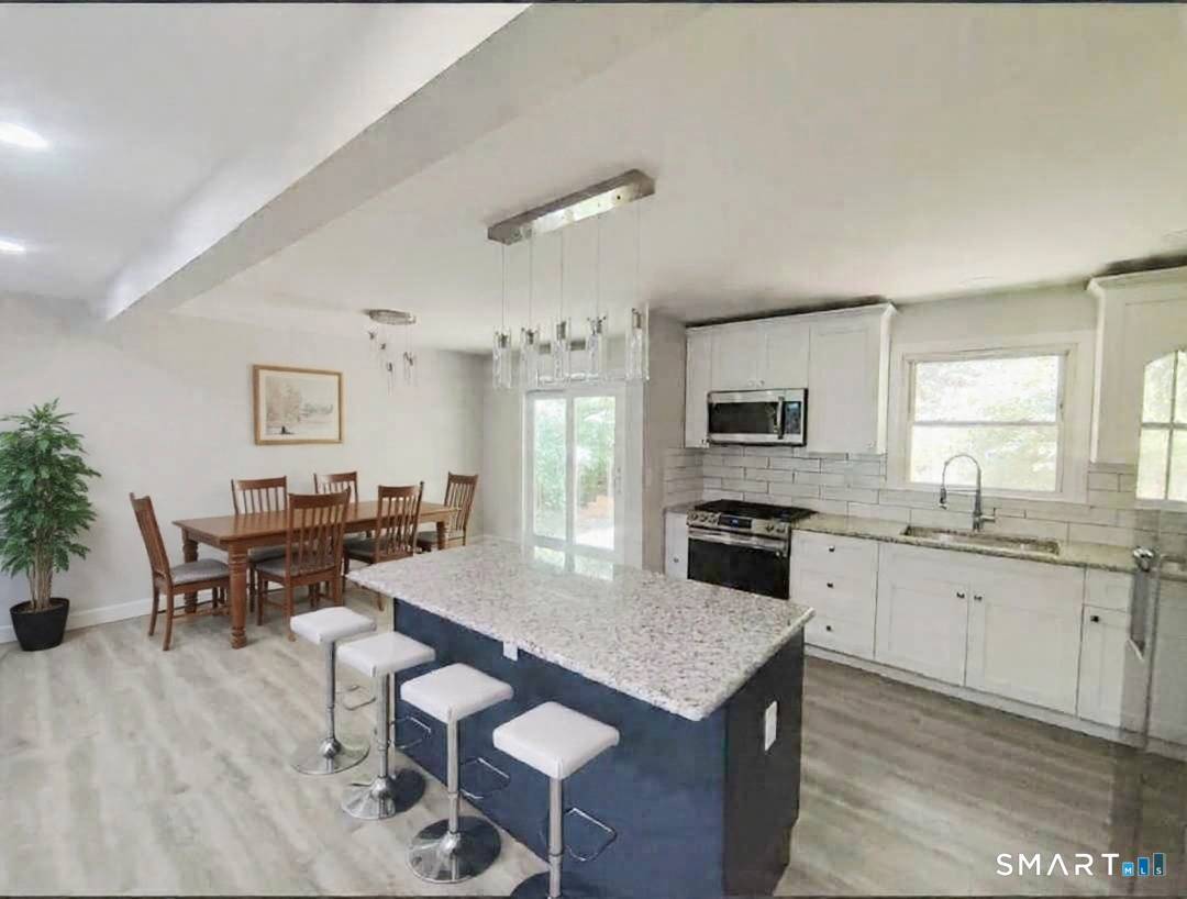 Step into this beautifully updated home featuring a bright, open floor plan and stylish finishes throughout.