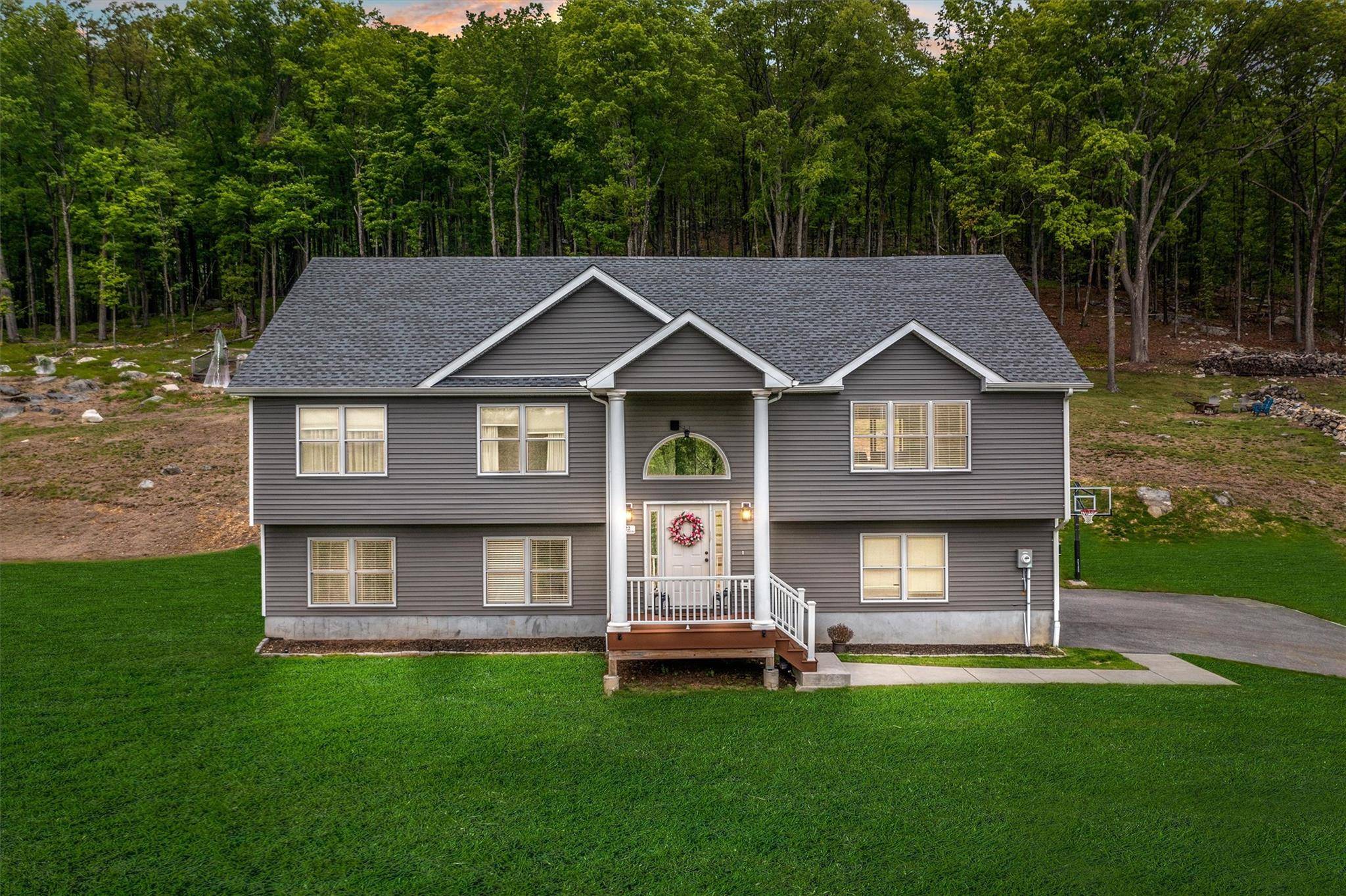 Newly constructed in 2022, this raised ranch in the heart of Mahopac sitting on 17.