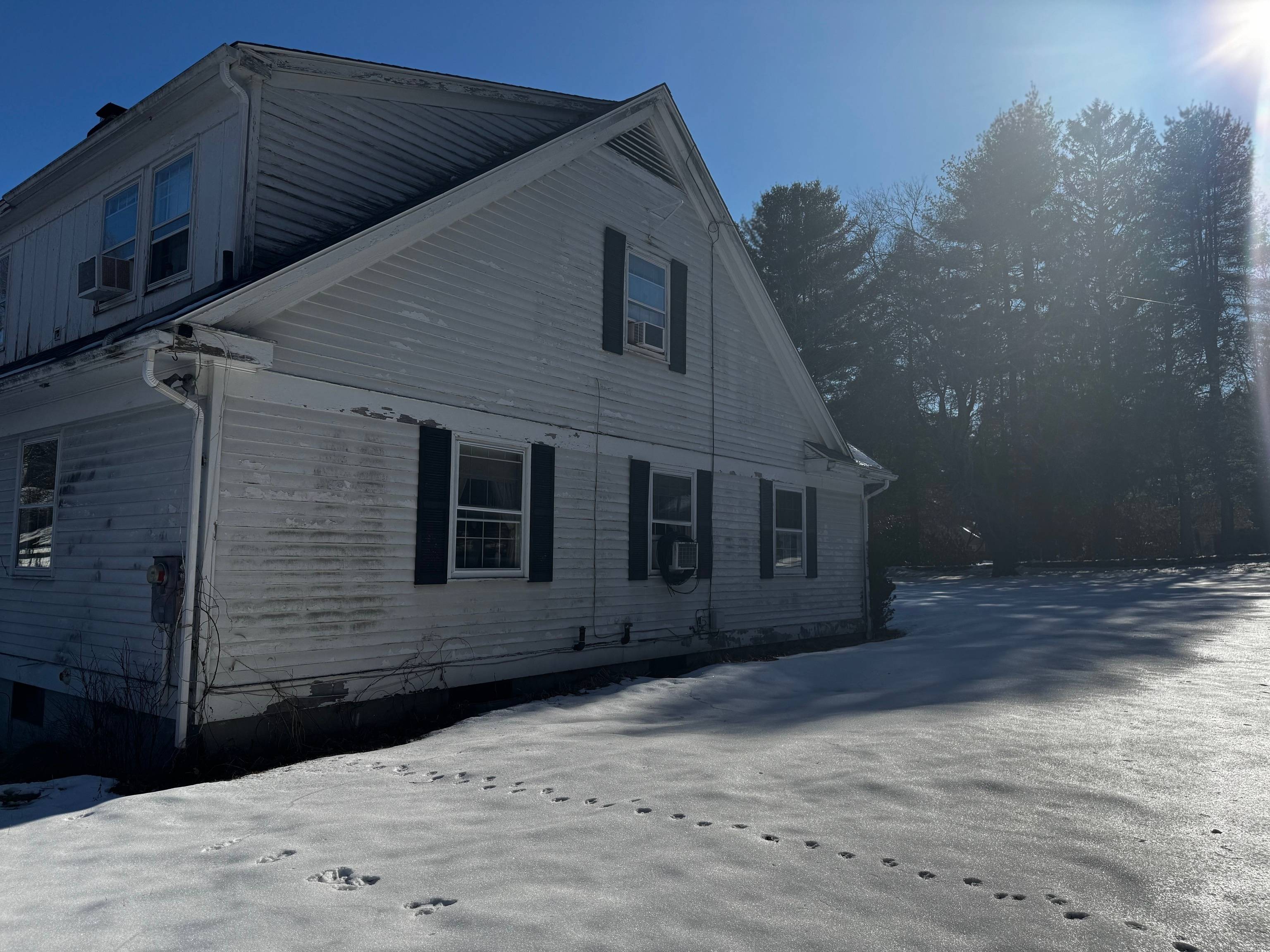 This expansive Cape Cod style home is a hidden gem, situated on 2.