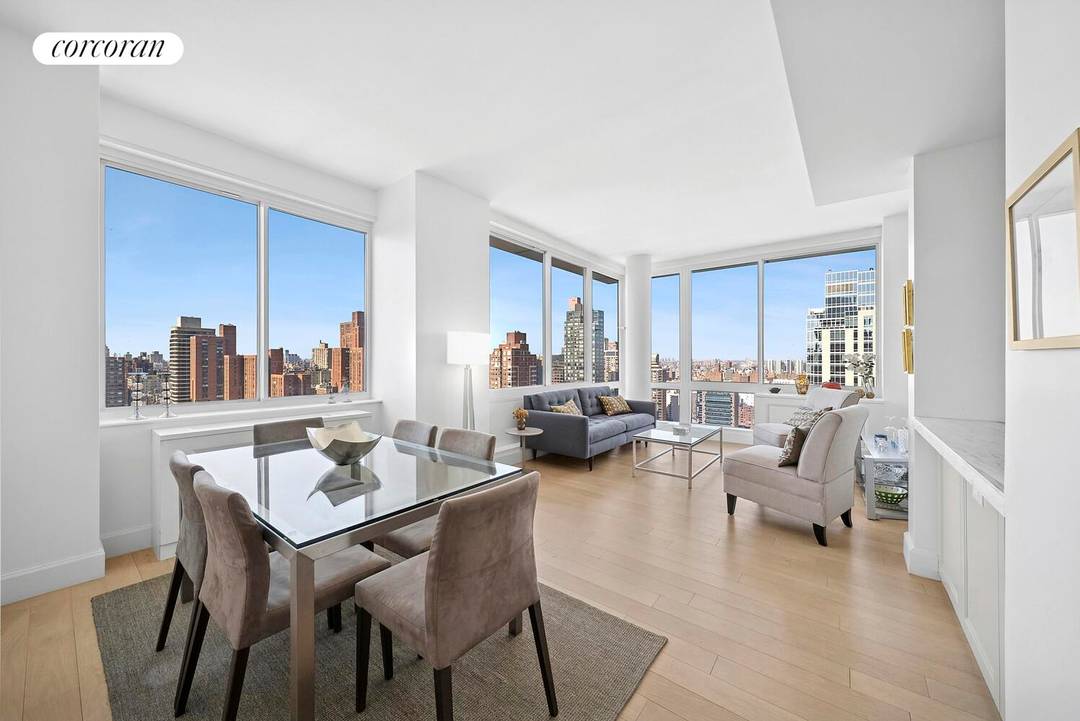 Perched on a high floor with sweeping city and river views, this exceptional corner residence offers a thoughtfully designed two bedroom, two bath layout bathed in brilliant northwestern light.