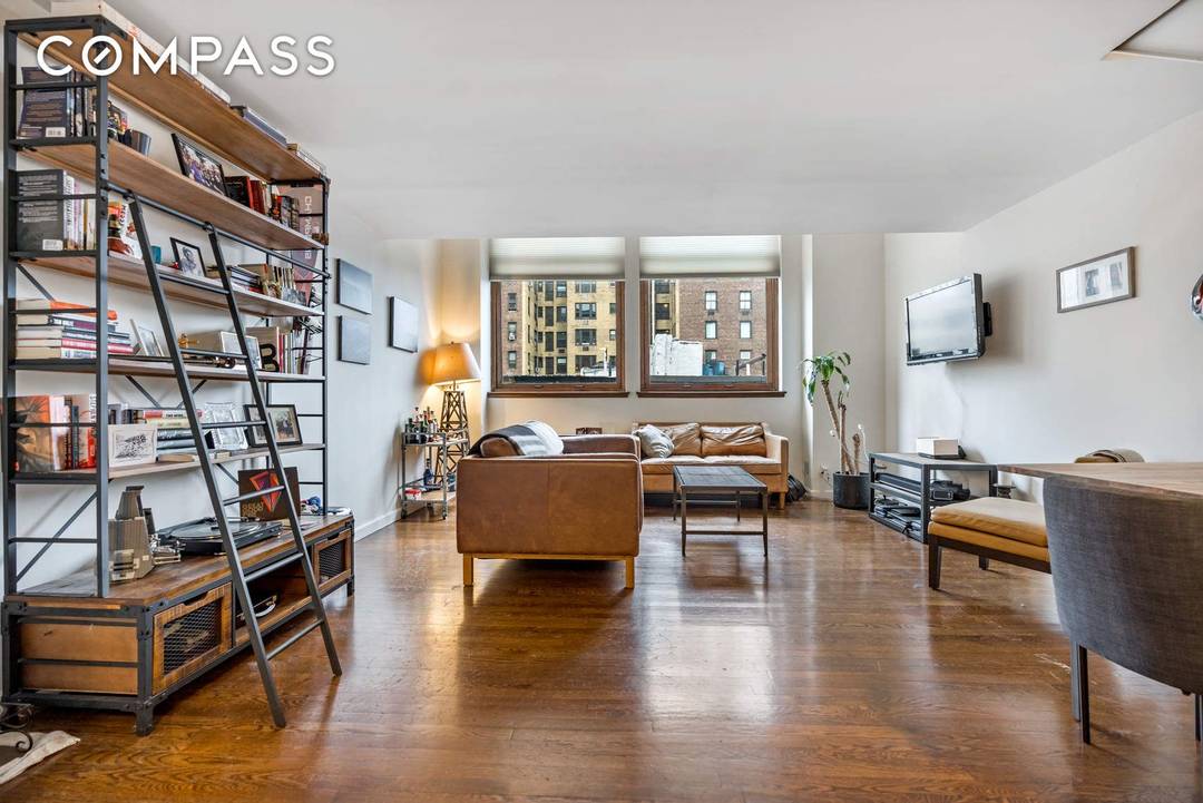 Dramatic and bright, this oversized one bedroom duplex loft features soaring 16 foot ceilings and oversized windows framing an open north view.