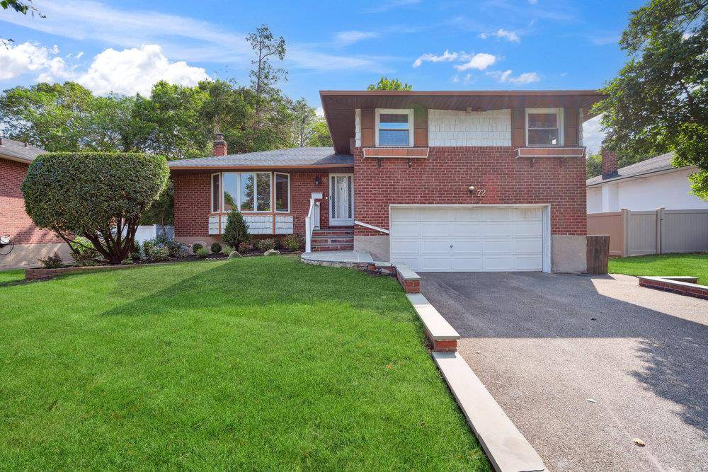 Move right into this updated split level home featuring an open concept main floor with a bright living room, dining area, and brand new kitchen with modern appliances.