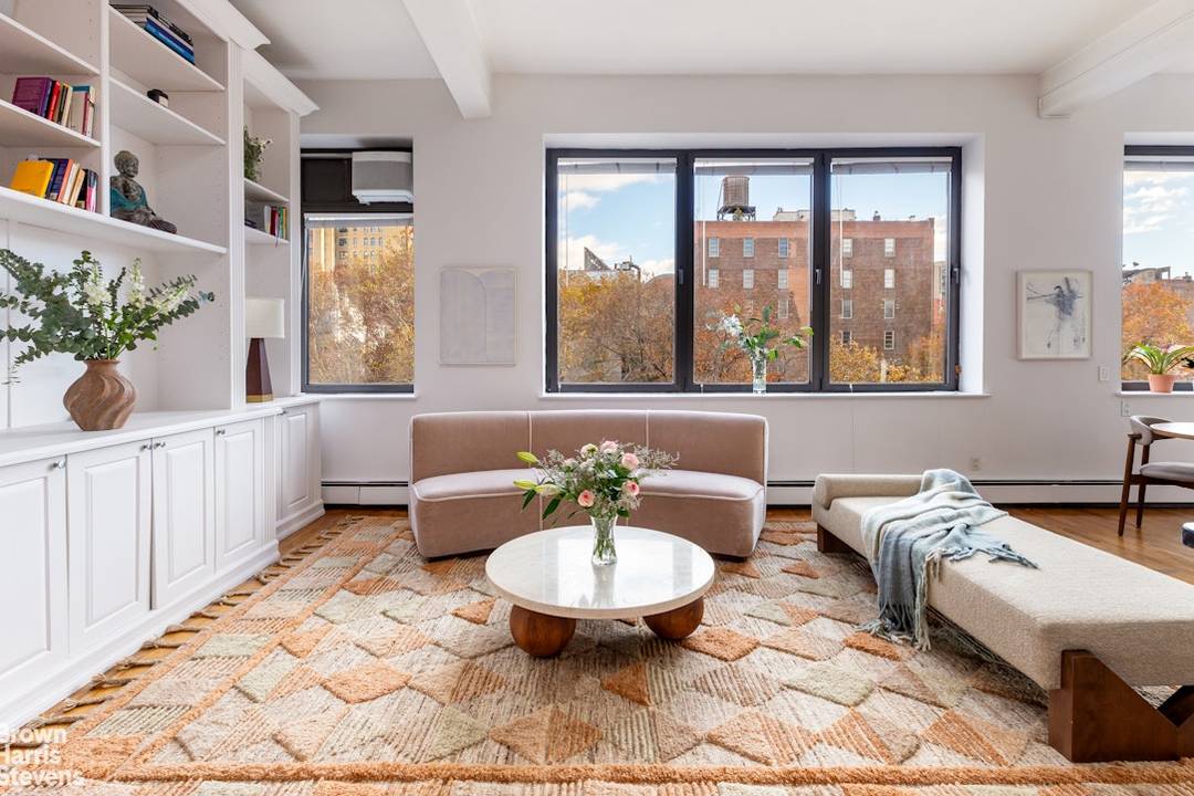 Step inside this West Village treasure, a rarely offered duplex loft where soaring 11.