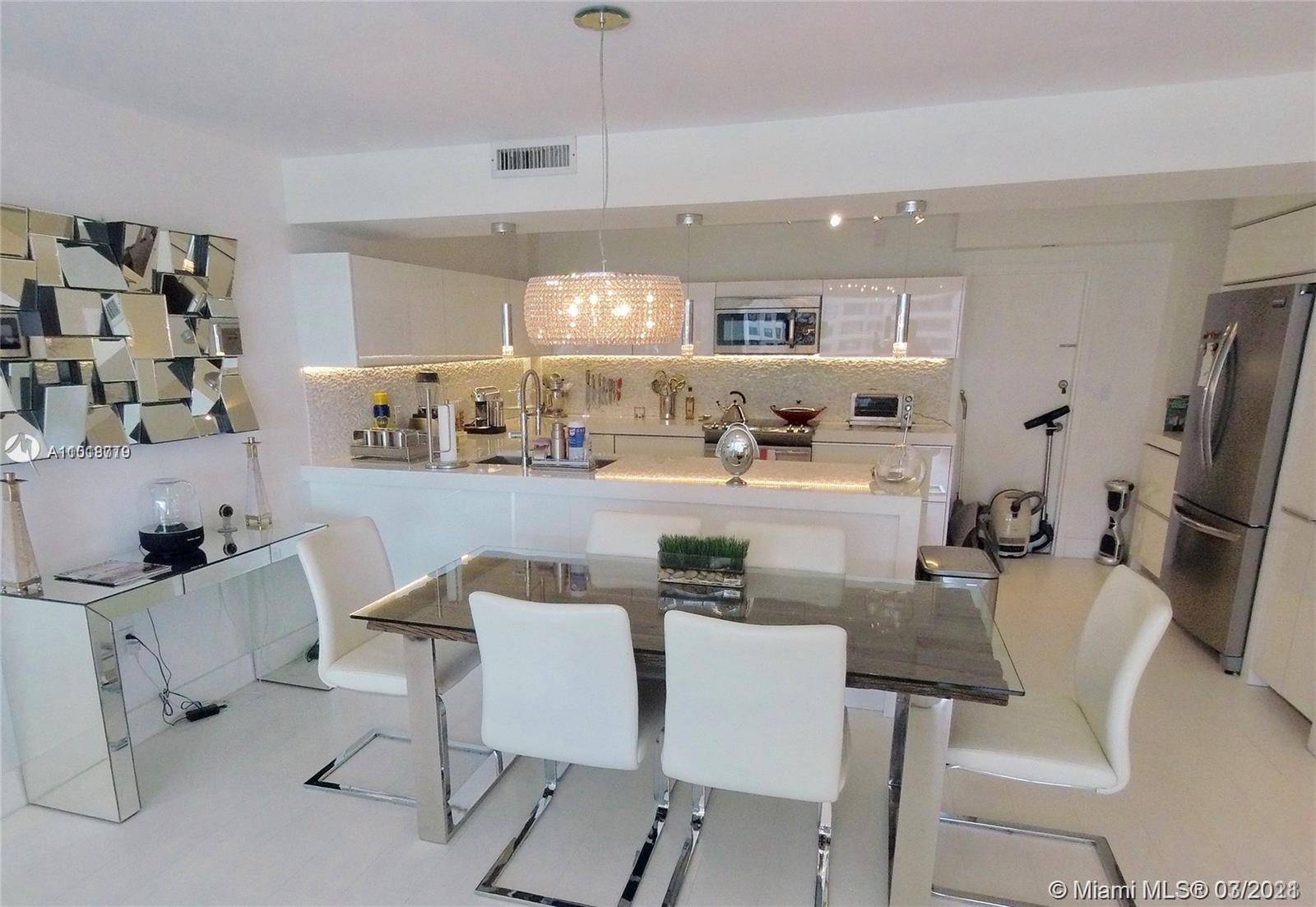 Spectacularly remodeled 2 bedroom 2 bath south side Commodore Club South apartment.