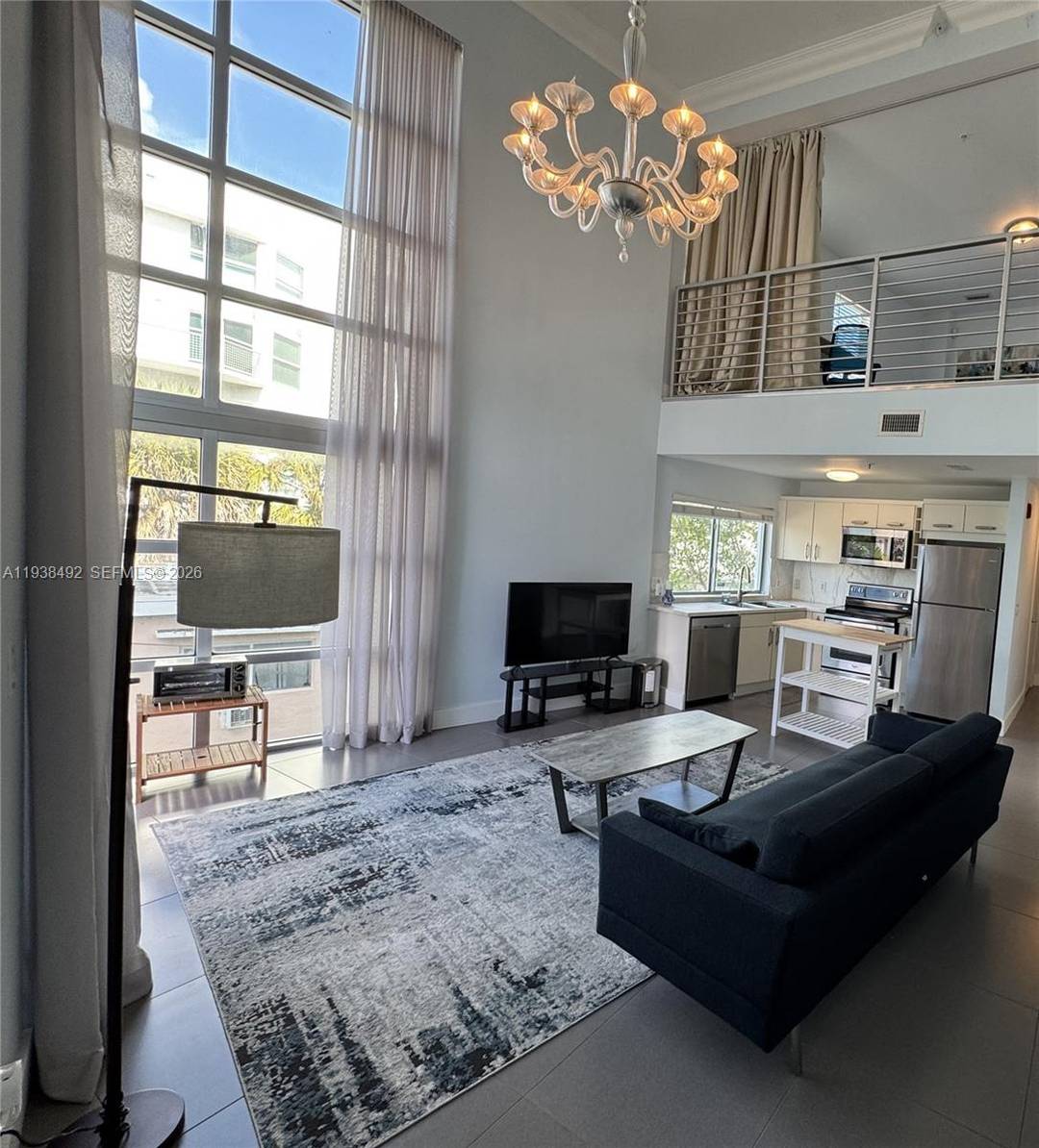 Experience the best of North Beach living in this contemporary 2 bedroom, 2 bath residence at the boutique Vilamur Condominium, complete with two assigned parking spaces.