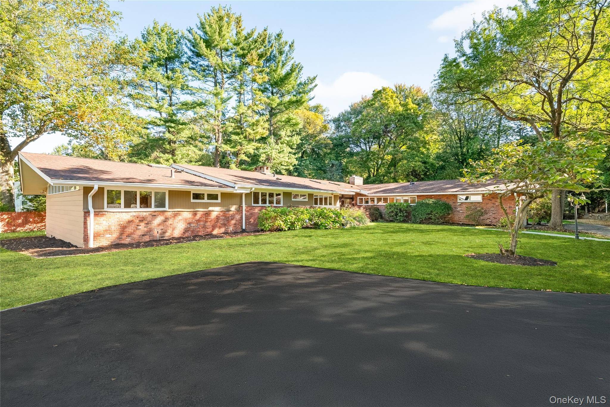 Home in Hartsdale Welcome to this beautifully maintained mid century modern gem, offering privacy, space, and timeless design.