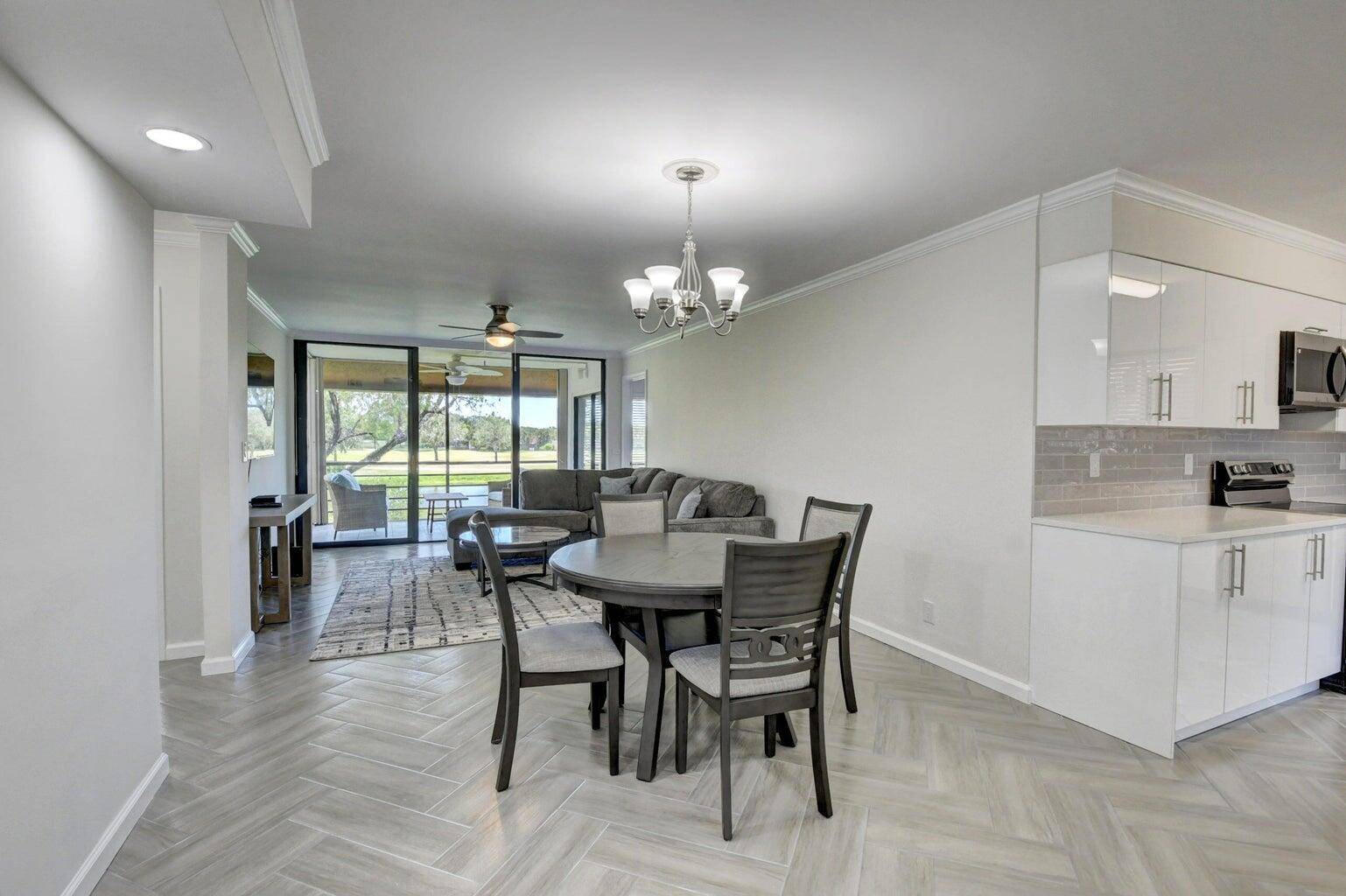 Beautifully renovated 2nd floor corner unit, located in the desirable Green Lakes section of the Indian Spring Country Club, offering serene golf course views and modern upgrades throughout.