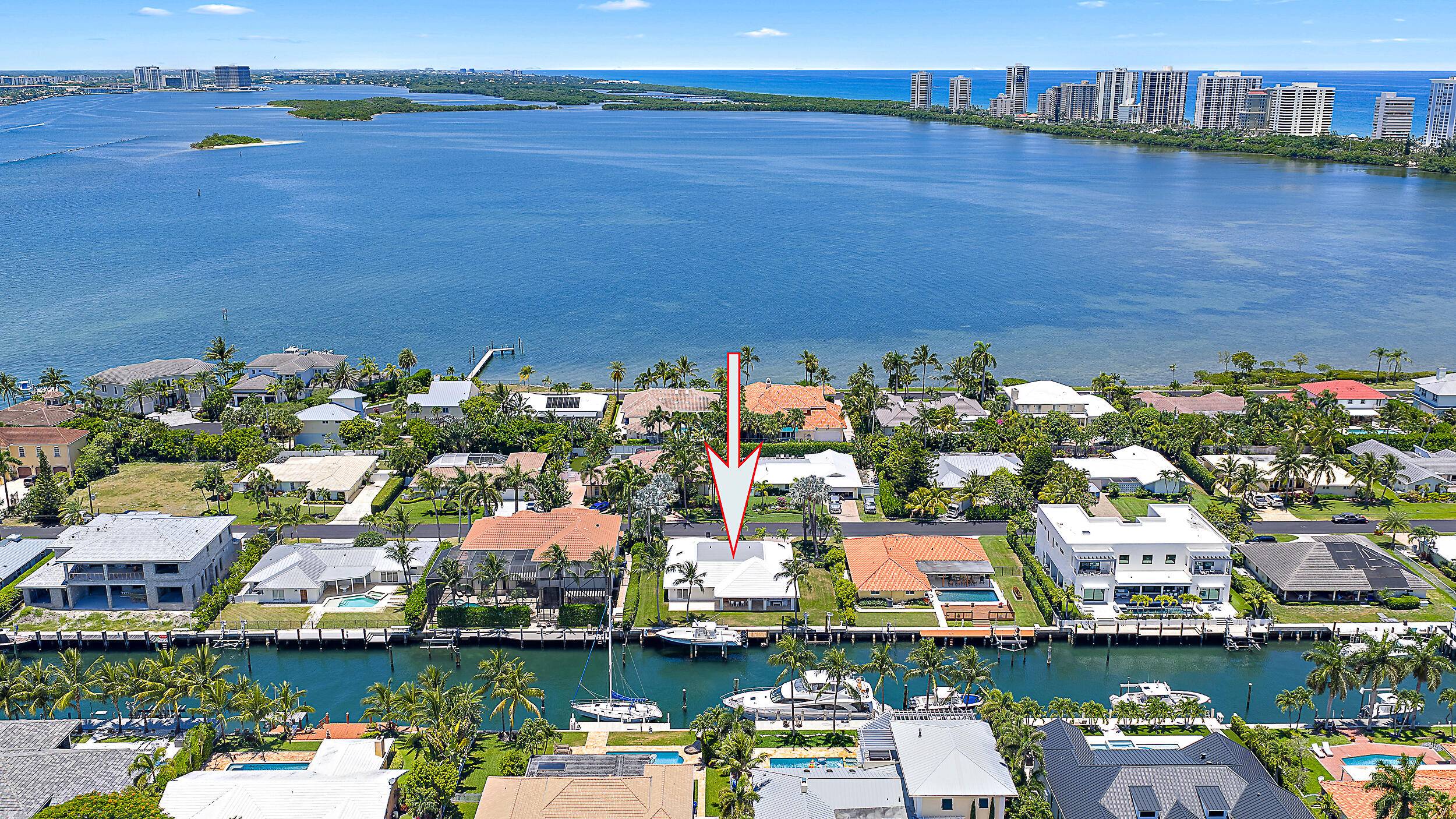 Just minutes from the Palm Beach Inlet this Palm Beach Isles home offers 100' of deepwater frontage, a 65' dock with two boat lifts 24, 000lbs 10, 000lbs.