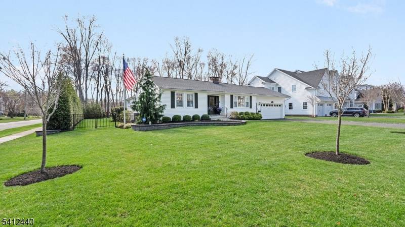 Beautifully updated 3 bedroom, 2 full bath ranch set on a rare, fully fenced.