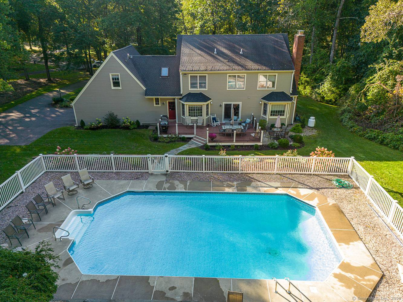 Welcome to 239 Old Farms Road This custom built Colonial is ideally situated on a picturesque 1.