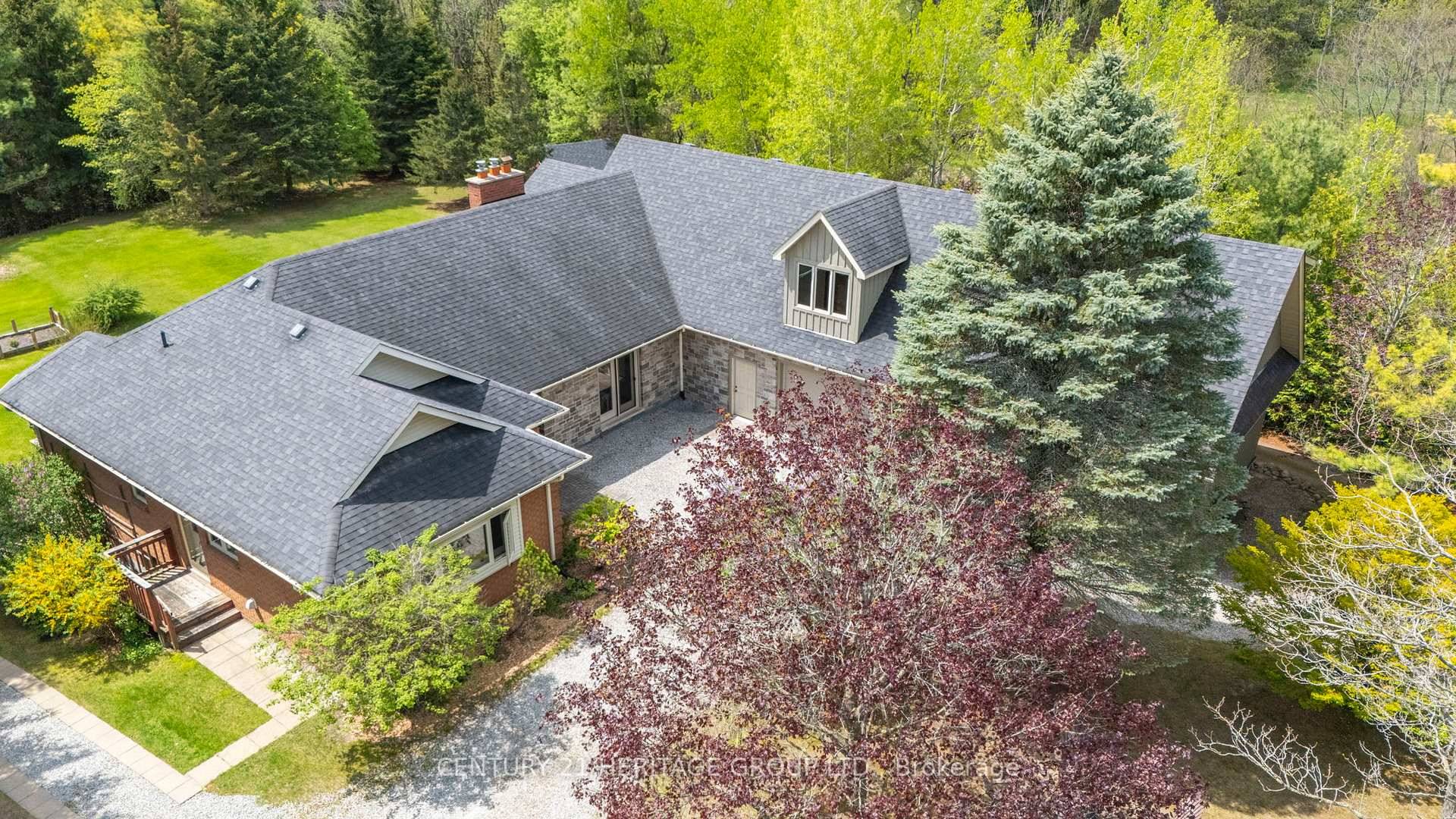 Discover the perfect blend of refined comfort and natural beauty on over 10 acres of land, featuring a private pond, mature trees, and wooded walking trails that offer unmatched privacy ...