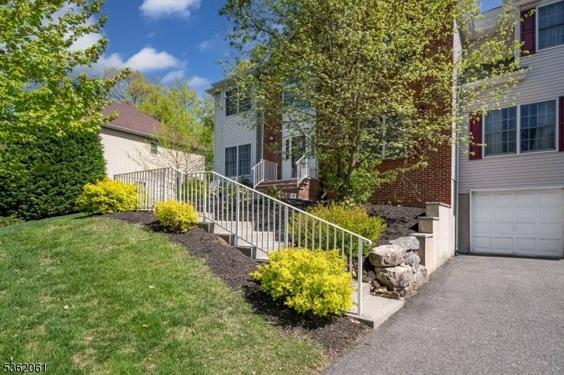 Step into this beautifully maintained Center Hall Colonial, featuring a dramatic two story foyer that sets the tone for this spacious and light filled home.