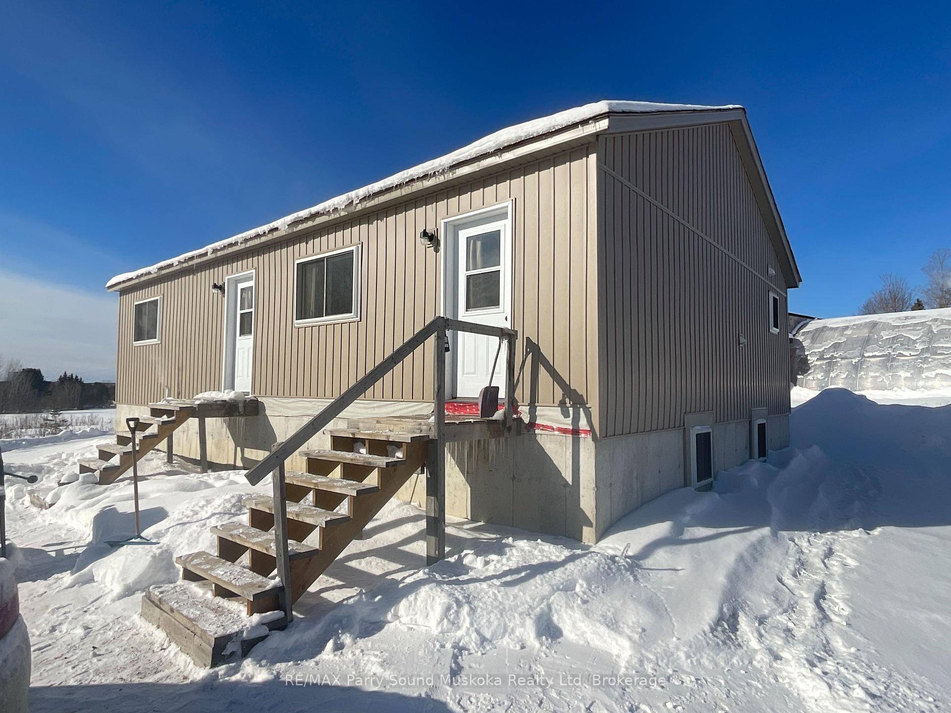 This newly built house is off grid, situated on 52 acres with a large oversized garage and set up as a turnkey business with huge potential.