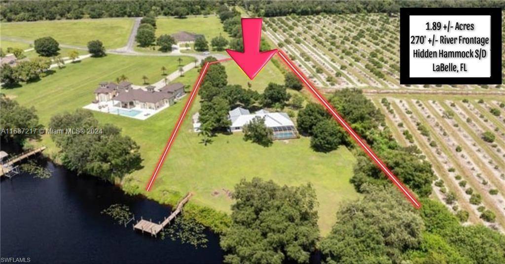 Home is a custom built 5BR 3BA home with new galvalume metal roof, two screened porches, caged pool, and private dock, perfect for a peaceful retreat or vibrant family home.